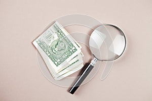 magnifier and money on white background
