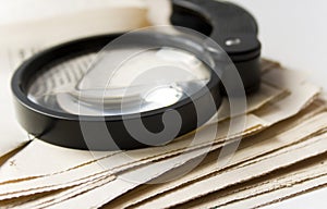 Magnifier and newspaper