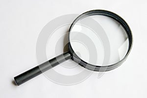 Magnifier on white background photo