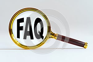 Magnifier on a white background, inside the text is written - FAQ