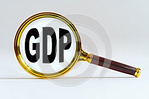 Magnifier on a white background, inside the text is written - GDP