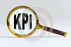 Magnifier on a white background, inside the text is written - KPI