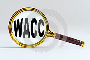 Magnifier on a white background, inside the text is written - WACC