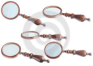 Magnifier with a wooden handle. Isolate on a white background, various angles. Brass, bronze, glass.