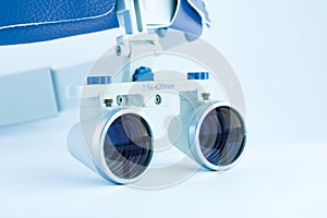 Magnifying binocular glasses close-up. Dental instruments in the