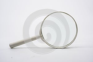 Magnifying glass against white background