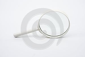 Magnifying glass against white background