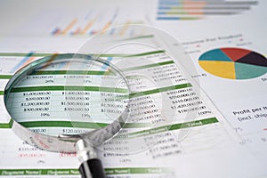 Magnifying glass on charts graphs paper. Financial development, Banking Account, Statistics, Investment Analytic research data