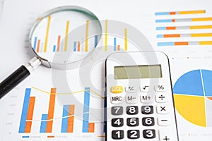 Magnifying glass on charts graphs paper. Financial development, Banking Account, Statistics, Investment Analytic research data