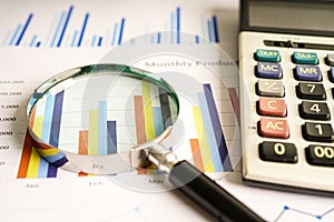 Magnifying glass on charts graphs paper. Financial development, Banking Account, Statistics, Investment Analytic research data