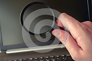 Magnifying glass and computer for spy