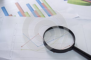 Magnifying glass and documents