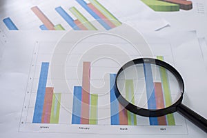 Magnifying glass and documents