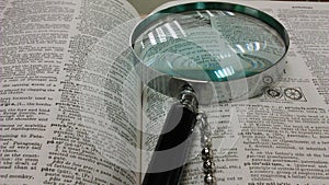 Magnifying glass and encyclopedia