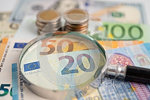 Magnifying glass and Euro banknotes background, Banking Account, Investment Analytic research data economy, trading, Business