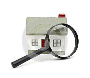 Magnifying glass examining model home