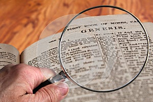 Magnifying Glass on Famous Bible Chapter Genesis photo