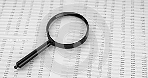 Magnifying glass on financial statement