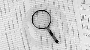 Magnifying glass on financial statement