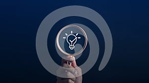 Magnifying glass focus to light bulb icon which for mind, creative, idea, innovation