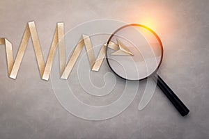 Magnifying glass focusing on a chart