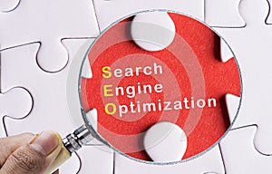 Magnifying glass focusing on SEO