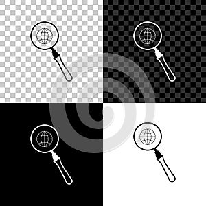 Magnifying glass with globe icon isolated on black, white and transparent background. Analyzing the world. Global search