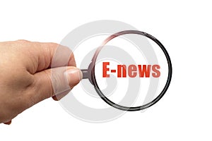 Magnifying glass in hand and a E-news word on the white background