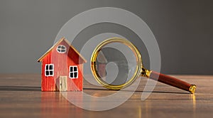 Magnifying glass with a house model. Real estate. Inspection