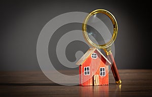 Magnifying glass with a house model. Real estate. Inspection