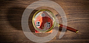 Magnifying glass with a house model. Real estate. Inspection