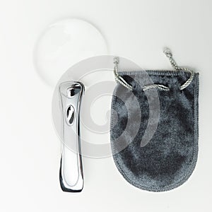 Magnifying glass isolated modern frameless beautiful shape magnification tool pouch photo