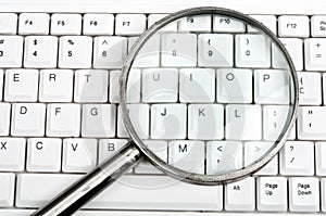 Magnifying glass on keyboard