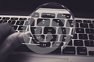 Magnifying Glass With Laptop Background