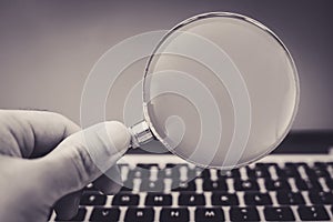 Magnifying Glass With Laptop Background