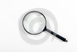 Magnifying glass or lens on white, top view