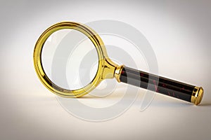 Magnifying glass on a light background. The concept of information search. Selective focus