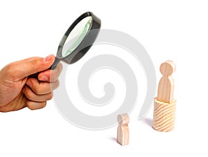 Magnifying glass is looking at the Magnifying glass is looking at the men stands on the podium and broadcasts his thoughts