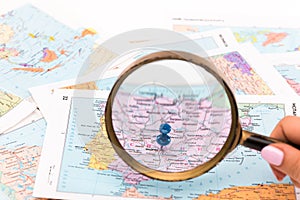 Magnifying glass on a map - close-up