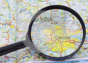 Magnifying glass over the map of London