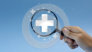 Magnifying glass with plus and medical icons for medical and health care concept, Access to welfare health, People with health