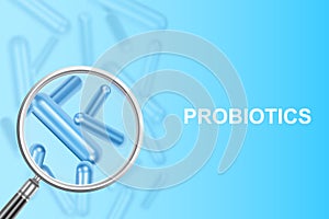 Magnifying glass with probiotics on blue background