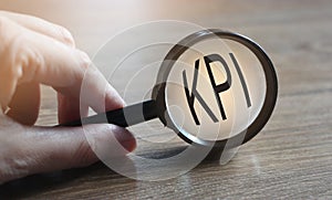 Magnifying glass searching KPI. Key performance indicator. Business concept