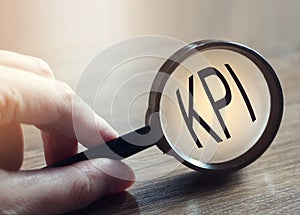 Magnifying glass searching KPI. Key performance indicator. Business concept