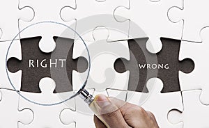 Magnifying glass searching missing puzzle peace