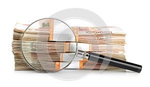 Magnifying glass and stack of rubles photo