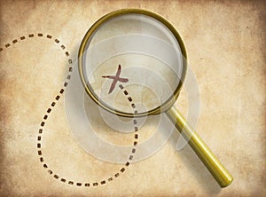 Magnifying glass and track with marked location on