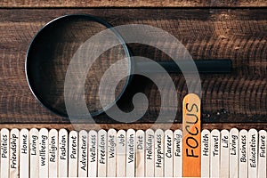 Magnifying glass and wooden sticks With LIFESTYLE related word
