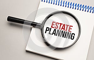 Magnifying glass with the word Estate Planning on chart background