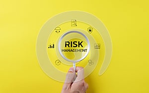 Magnifying glass with word risk management. Risk analysis in Business or finance and assessment for business investment.